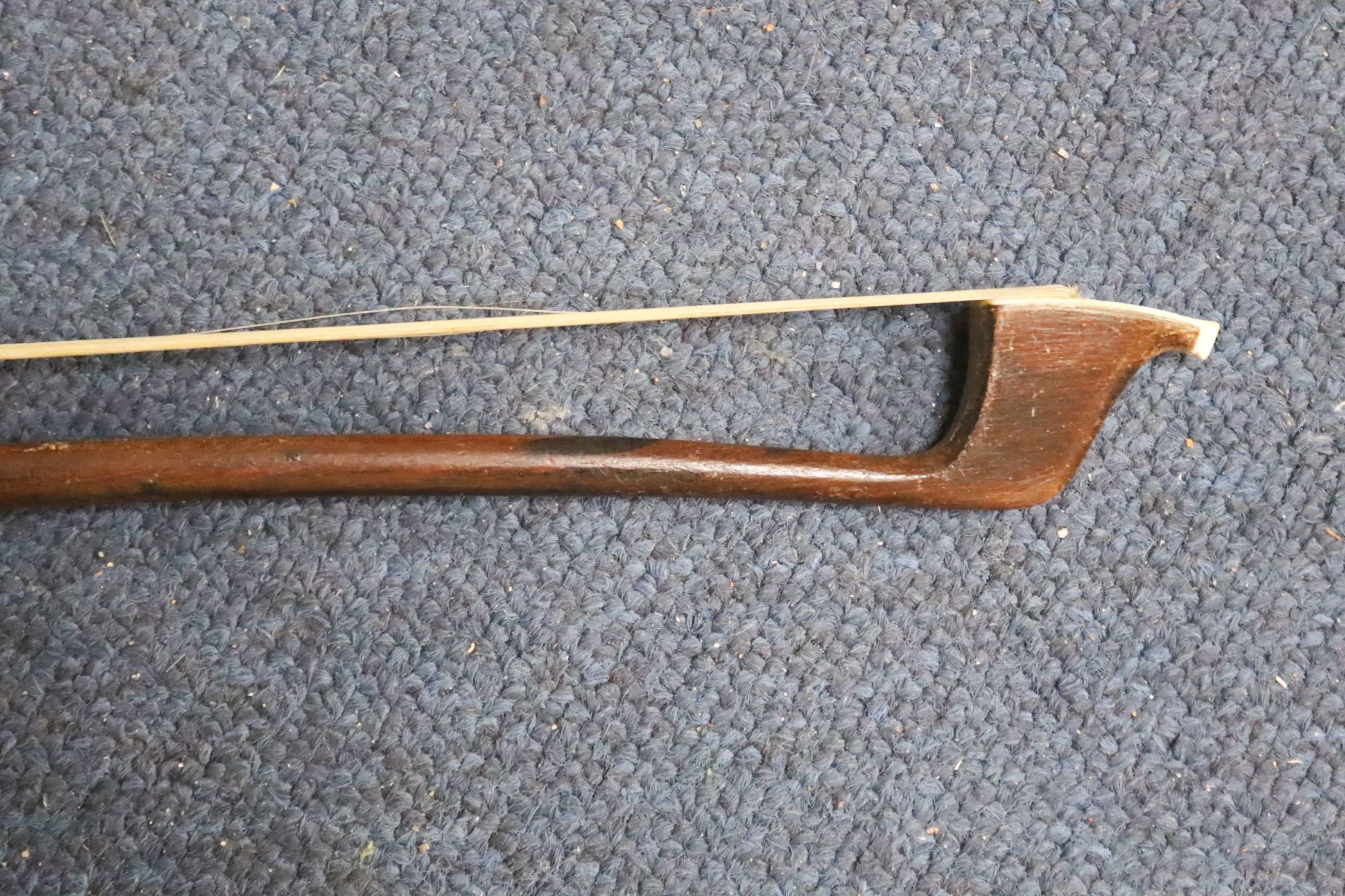 Early 20th century German cello and bow, the back measuring 75cm excluding the button